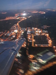 SX32638 Airplane wing over city lights.jpg